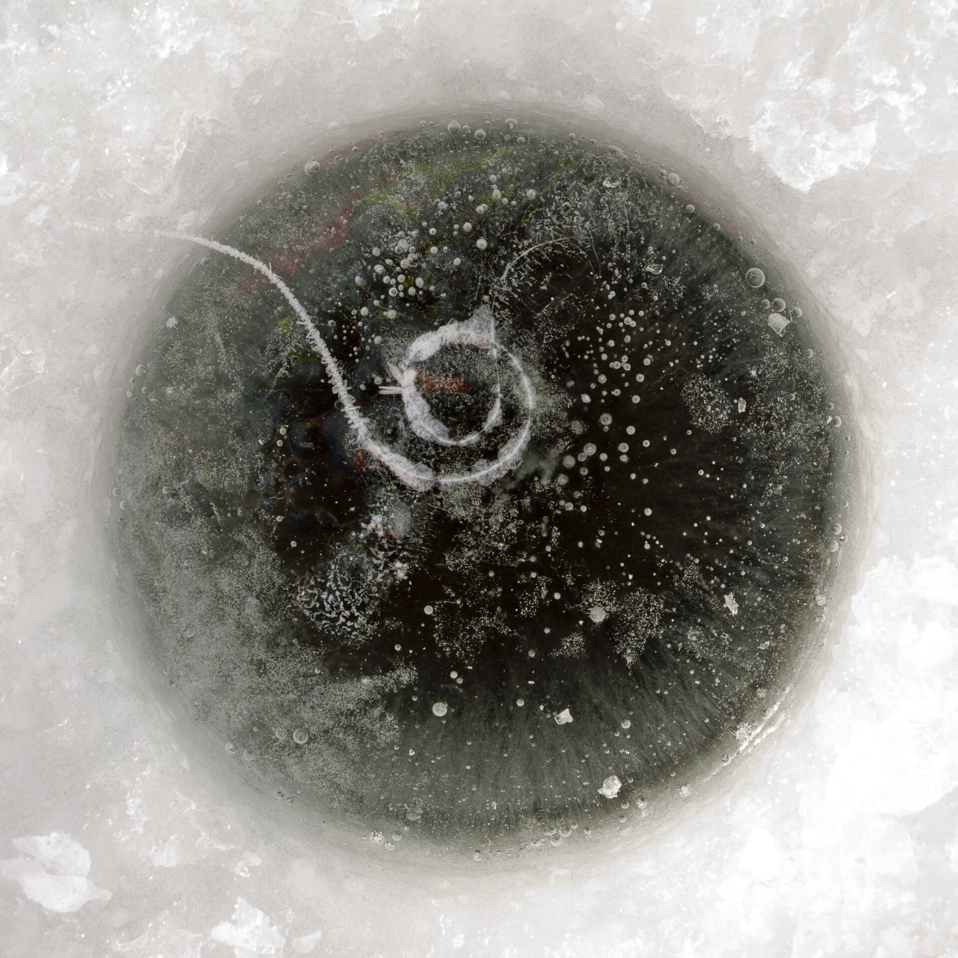 Frozen ice fishing hole