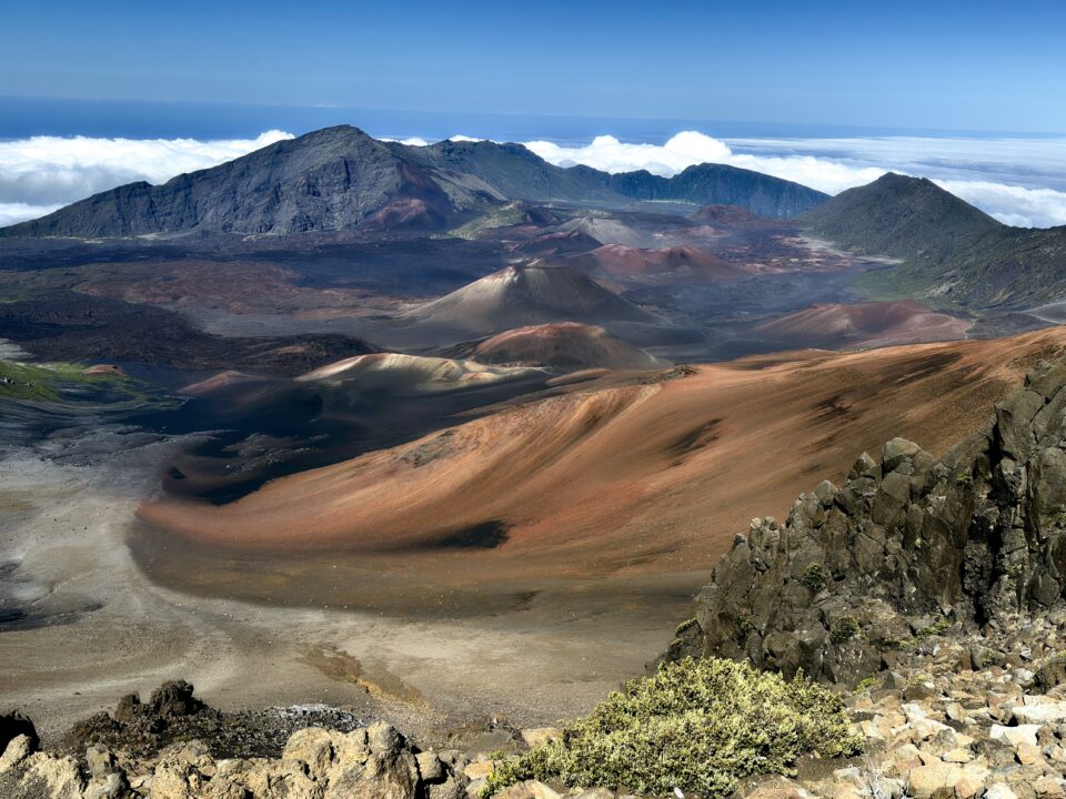 A volcanic crater landscape at Haleakala National Park, styled to look like a prehistoric planet