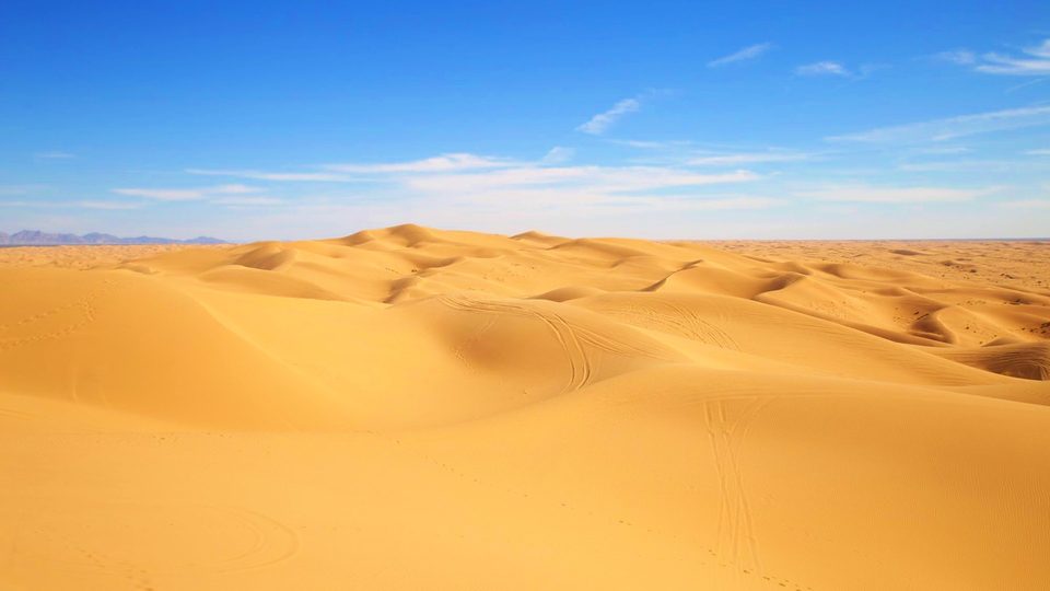 Same sand dunes after the Super Vivid LUT, with golden sand and a deep blue sky